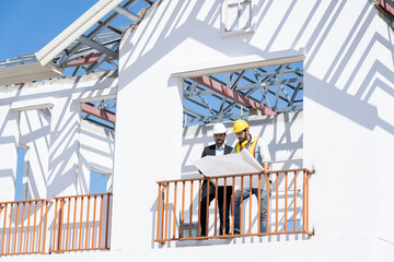Fototapete - The businessman or boss gives the consultant to engineer,They are consulting and solving the problems in construction site planning for new house.