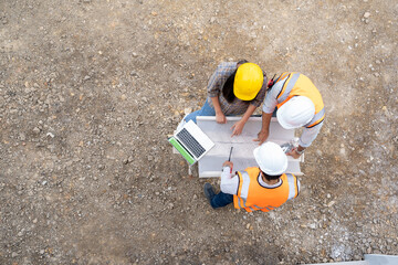 Aufkleber - aerial view of structural engineer and architect work working in progress of construction project at construction site,construction residential new house in progress at building site.