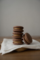 Wall Mural - Sweet multicolored macaroons on a wooden background. Delicious multicolored macaroons. High-quality photography.