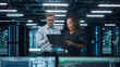 © Gorodenkoff - Multiethnic Diverse Office Meeting: Team of Two Creative Entrepreneurs Talk, Discuss Growth Strategy, Looking at the Laptop. Businesspeople Work on Digital e-Commerce Startup Project.