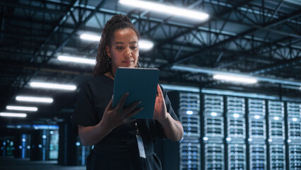 Poster - Successful Female IT Specialist Using Laptop Computer, while Standing at Big Warehouse Data Center. System Administrator working with Computing SAAS, Cloud Services. E-Business Digital Entrepreneur