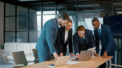 Poster - Young people in suits discussing in the office