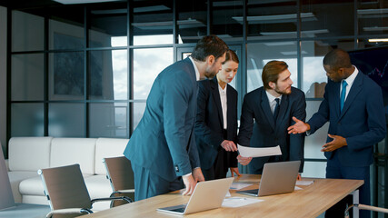 Poster - Corporate business team in a meeting. Group of young people in suits