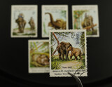 Fototapeta  - Znaczki pocztowe - Laos - XX wiek, lata 80., słonie, praca ludzi. Kolekcja znaczków, hobby.