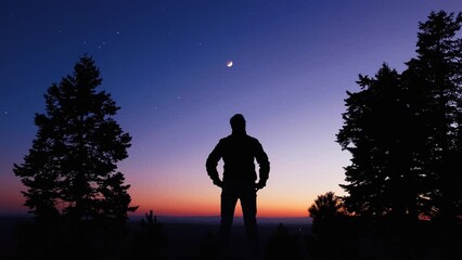 Wall Mural - man observing evening sky with stars, planets and crescent moon.