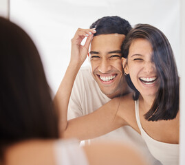 Poster - We both woke up on the right side of the bed. Shot of a happy young couple standing together in their bathroom in the morning.