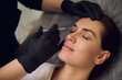 © Taras Grebinets - Close-up of beautiful middle aged woman getting beauty injections on her forehead in wellness spa cosmetology clinic. Botulinum toxin injection and hyaluronic acid for anti-wrinkle anti-aging therapy
