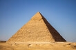 Pyramid Khafre with row of walking camels Giza, Cairo, Egypt