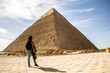 Woman looking at Pyramid Khafre, Giza, Cairo, Egypt
