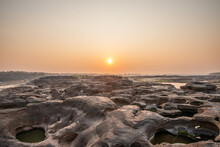 Sunrise At Three Thousand Waved Rocks Under The Natural Sandstone Group Of The Mekong River That Has Been Eroded For A Long Time In Ubon Ratchathani, Thailand.