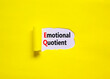 EQ emotional quotient symbol. Concept words EQ emotional quotient on yellow paper on a beautiful yellow table white background. Business EQ emotional quotient concept, copy space.