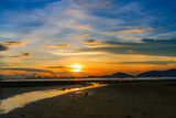 Fototapeta Lawenda - sunset over Deep Bay on the beach in Hong Kong Pak Nai