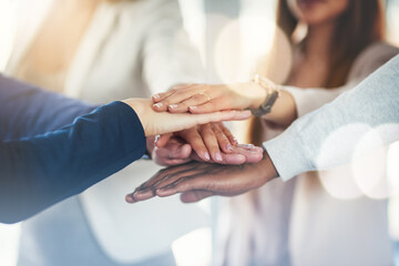 Poster - Lets do it together. Cropped shot of a group of businesspeople putting their hands together in a huddle.