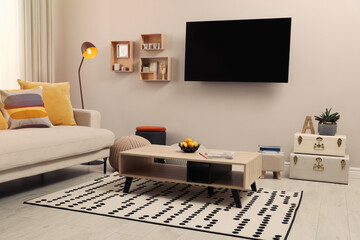 Sticker - Modern TV, comfortable sofa and decor elements in living room