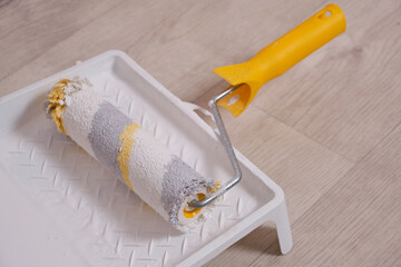 Wall Mural - Roller tray with white paint and paint roller.