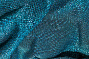 Wall Mural - Texture of shiny sparkling lurex fabric blue color.