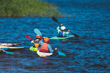 Kids Learn Kayaking, Canoeing Whitewater Training In The Lake River, Children Practicing Paddling, Yound Kayakers In Summer Camp