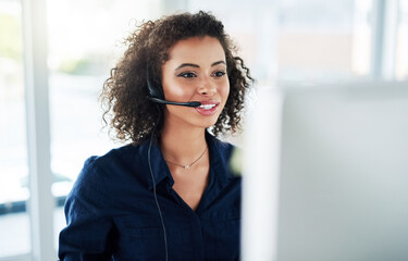 Poster - Shes determined to help as many customers as possible. Cropped shot of an attractive young female call center agent working in her office.