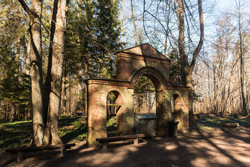 Wall Mural - An old gate built of red bricks in the woods on a sunny spring day, Ivande, Latvia.