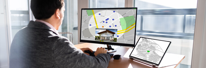 Poster - Businessperson Analyzing Cadastre Map On Computer