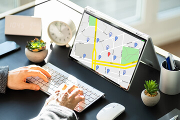 Man Using GPS Map With Navigation Pointers