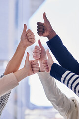 Poster - Positive about business. Cropped shot of a group of businesspeople giving thumbs up in an office.