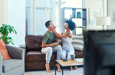 Poster - Youre going to make me lose. Shot of a woman trying to get her boyfriends attention while he plays video games.