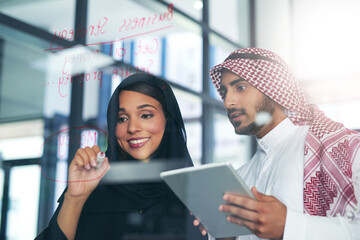 Aufkleber - Facilitating innovation with a brainstorming session. Shot of two muslim colleagues having a brainstorming session at work in a modern office.