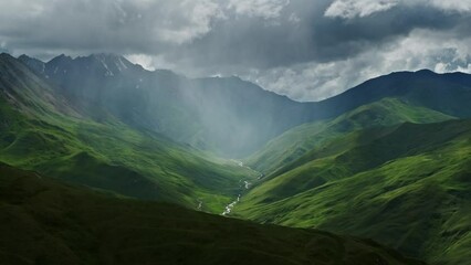 Wall Mural - beautiful mountain landscape with rain clouds and sun rays in canyon, 4k