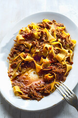 Canvas Print - rustic italian pappardelle pasta in bolognese sauce