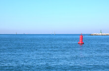 Red Buoy In The Middle Of The Sea To Indicate The Presence Of The Dam On Boats Near The Island Of Venice In Italy
