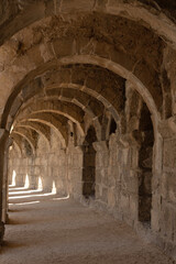  Light and shadow in ancient building with many arches in it