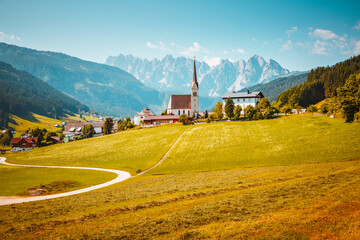 Fototapete - Picturesque touristic alpine village with catholic church on a sunny day. Gosau village, Upper Austria.