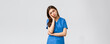 Healthcare workers, prevent virus, insurance and medicine concept. Exhausted and sleepy female nurse, doctor in scrubs, lean on palm look tired, feel fatigue from night shift at hospital