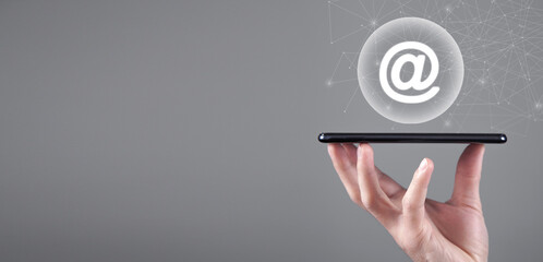 Wall Mural - male hand showing smartphone with a email symbol.