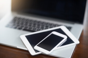 Poster - Digital devices at the ready. High angle shot of various digital devices on a table.