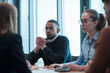 © .shock - Successful team. Group of young multi-ethnic business people working and communicating together in creative office. Selective focus