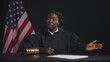 African American female judge addressing members of the jury, court proceeding