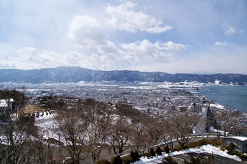 Wall Mural - The landscape of Suwa city with snow cover in winter.