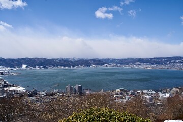 Wall Mural - The view of Lake Suwa and good wether from a hill of Tateishi Park in Nagano.