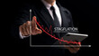 © Thapana_Studio - The concept of the collapse of the stalled economy. Inflation risk. The graph shows the recession, the male businessman touches the red downward curve.