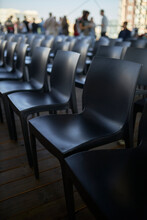 Many Black Chairs In A Row. Evocative Series Of Chairs. Rows Of Chairs, Empty Seats - Chair Row