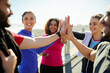 © Delmaine Donson/peopleimages.com - Lets do this guys. Shot of a group of young cheerful friends giving high fives before a fitness exercise outside during the day.