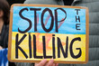 stop the killing sign with Ukranian flag colors