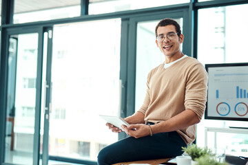 Poster - Im always in search of new opportunities to connect to. Portrait of a young designer working on a digital tablet in an office.
