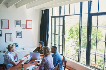 Poster - Growing a business brand with superb teamwork. Cropped shot of entrepreneurs meeting Shot of a diverse group of businesspeople having a meeting in a modern office the boardroom.