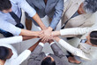 © Yuri A/peopleimages.com - In diversity we will succeed. Shot of a group of coworkers with their hands in a huddle.