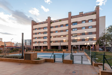 Wall Mural - Facade of an urban residential apartment building with swimming pools and common areas