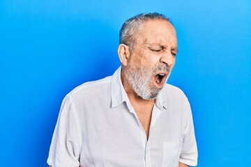 Poster - Handsome senior man with beard wearing casual white shirt with hand on stomach because nausea, painful disease feeling unwell. ache concept.