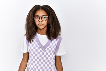 Poster - Young african american girl standing over isolated background with serious expression on face. simple and natural looking at the camera.